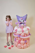 Kuromi Birthday Balloon Display with pastel pink, white, lavender balloons, heart accents, balloon florals, and cake-style birthday decor