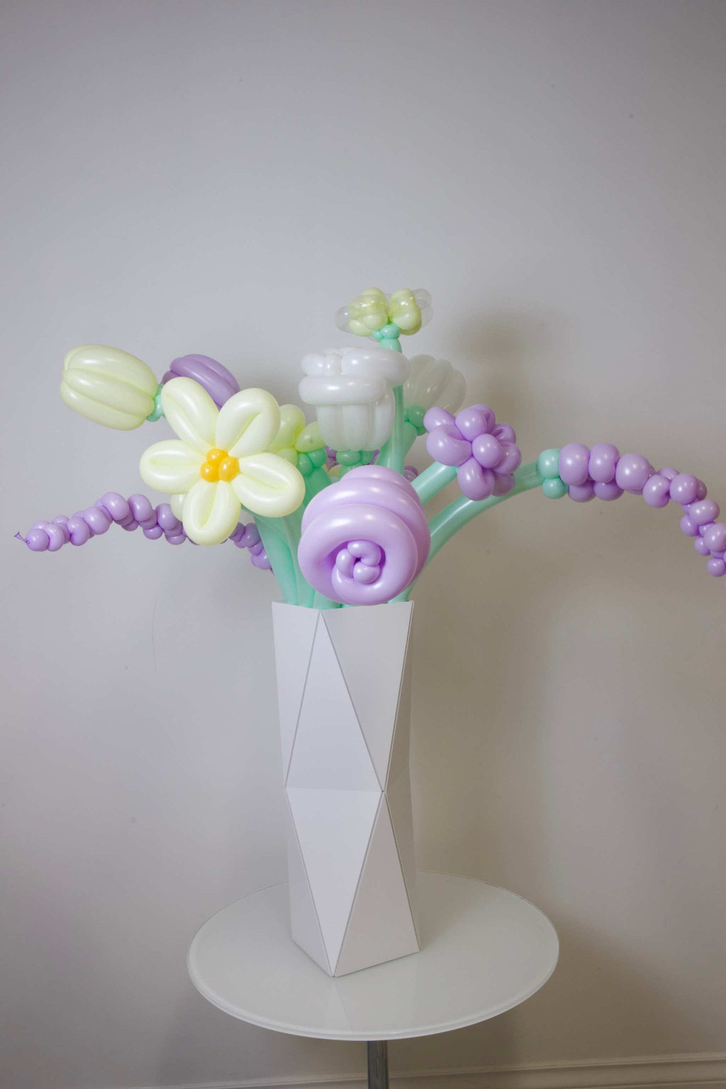 Handmade balloon flowers arrangement in a designer vase for elegant balloon gift decor in Toronto and the GTA