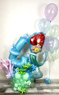 Mermaid Birthday Balloon Display with custom number balloon, pastel ocean colours, under the sea accents, and kids party decor