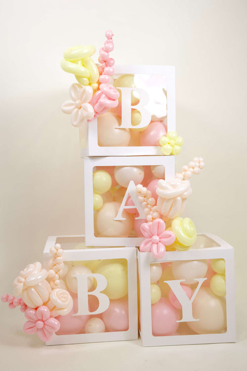 Baby Shower Balloon Box Display with BABY boxes, pastel baby girl balloons, blush buttercream colours, and floral balloon accents