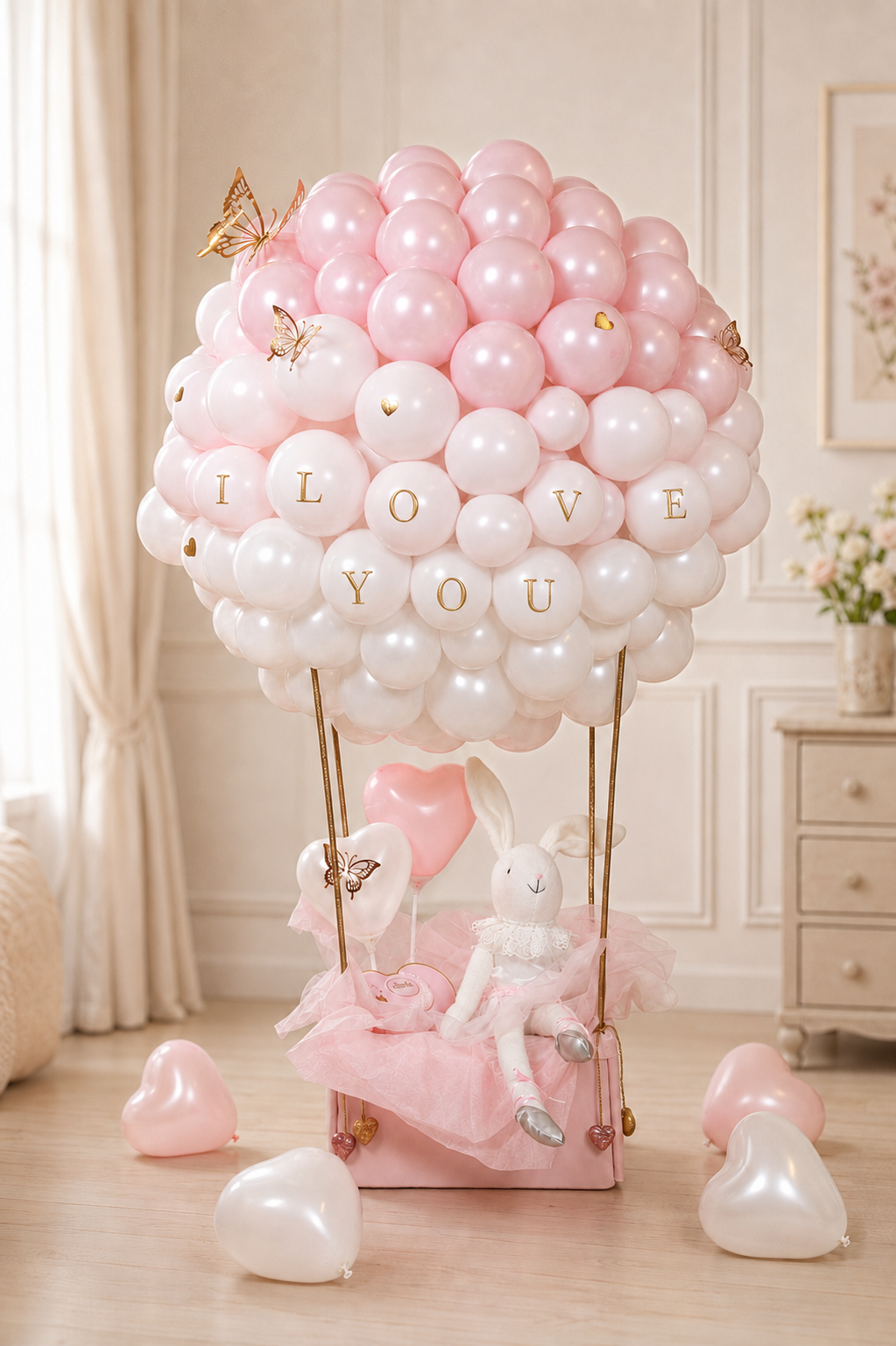 Blush ombré floral bunny hot-air balloon gift arrangement with roses and greenery in Toronto