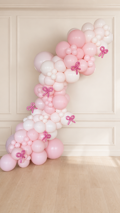 Blush Bow Balloon Garland with blush pink, ivory balloons and metallic pink bows for celebrations
