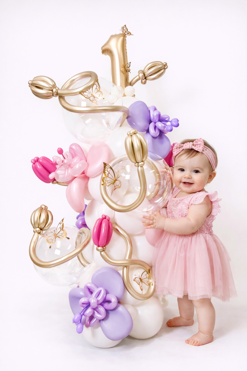 Luxury Butterfly Balloon Decoration with pink, lavender, gold, clear bubble balloons, butterfly accents, and number balloon for a baby girl birthday in Toronto.
