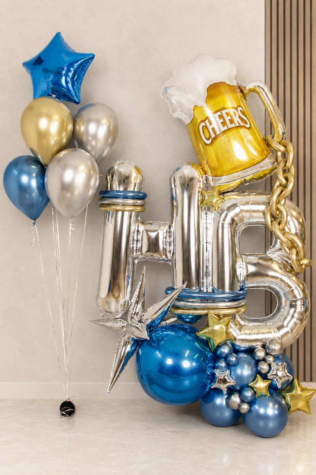 Men's blue, silver and gold birthday balloon display with HB letters, Cheers beer mug balloon, gold chain and helium bouquet in Toronto