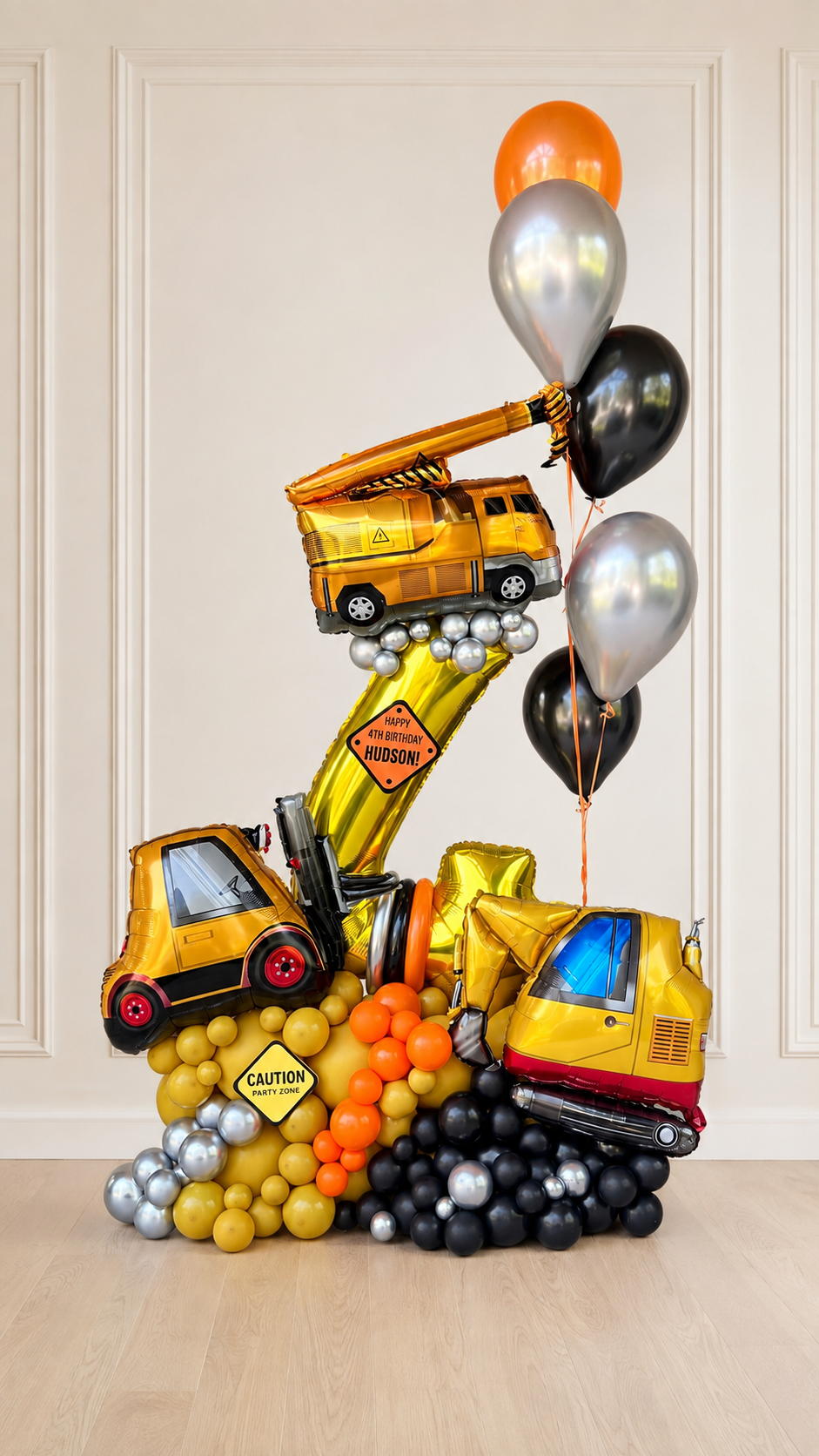 Deluxe construction number 4 balloon display with crane truck, forklift and excavator in yellow, orange, black and chrome silver for a kids birthday in Toronto