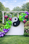 Dragon Yin-Yang birthday balloon installation with green and purple dragons and custom yin-yang balloon feature on white backdrop