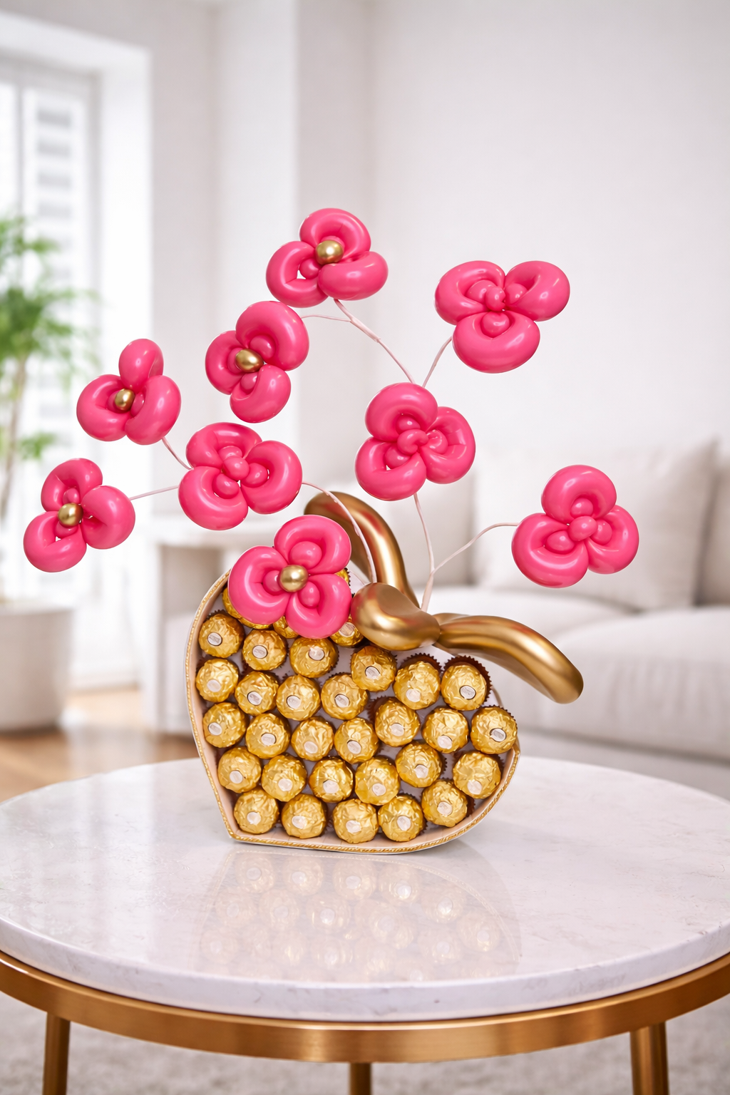 Ferrero Rocher Balloon Gift with pink orchid-style balloon flowers in a heart-shaped chocolate box
