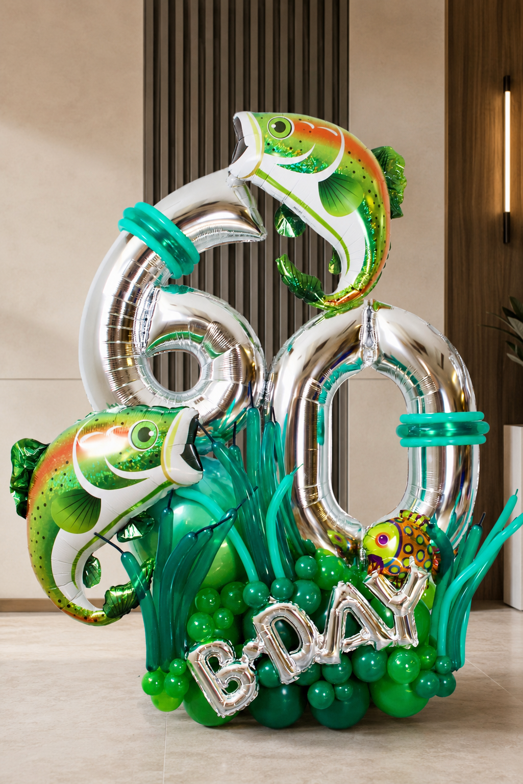 Fishing milestone number balloon display with silver age numbers, green and aqua balloon base, fish balloons and BDAY letters for a men's birthday in Toronto