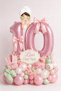 Pink spa birthday balloon arrangement with personalized number balloons, spa accessories and flowers for a girls birthday in Toronto