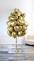Gold Heart Balloon Bouquet with metallic heart foil balloons and gold ribbon for luxury balloon delivery in Toronto