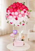 Pearl blush and white I Love You bunny hot-air balloon gift arrangement in a luxury nursery