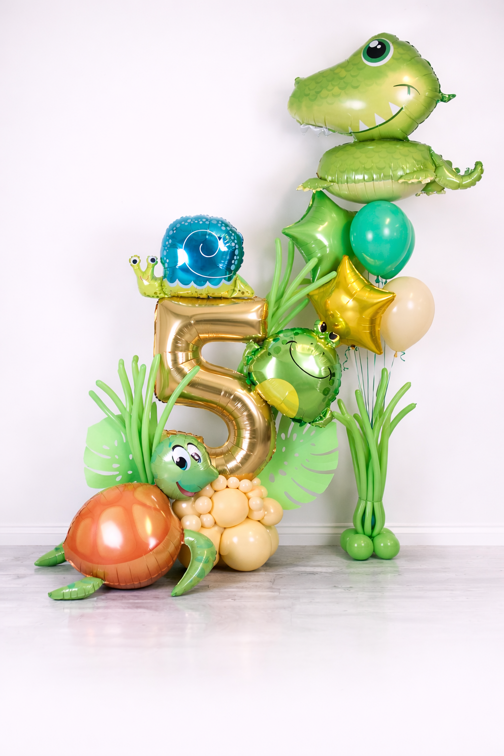 Reptile Balloon Number Display with custom age number, crocodile, turtle, snail, tropical greenery, star balloon, and jungle party decor