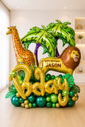 Luxury jungle safari baby balloon display with personalized lion, giraffe, palm trees and emerald balloon base in Toronto