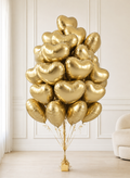 Luxury bouquet of 30 metallic gold heart foil balloons for birthday and event delivery in Toronto
