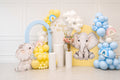 Pastel elephant gender reveal balloon installation with blue, yellow and white balloons in Toronto