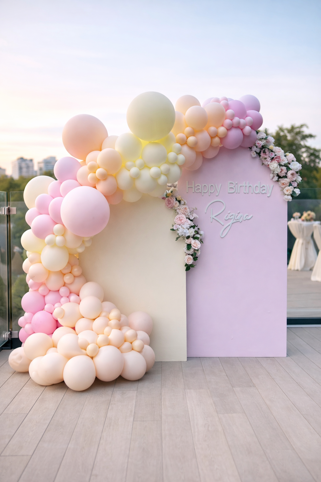 Pastel Bloom Birthday Backdrop with layered curved panels, pastel balloon garland, floral accents, and custom lettering for elegant celebrations