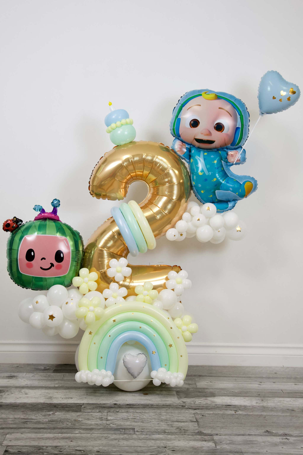 Pastel rainbow number balloon arrangement for a children’s birthday celebration in Toronto