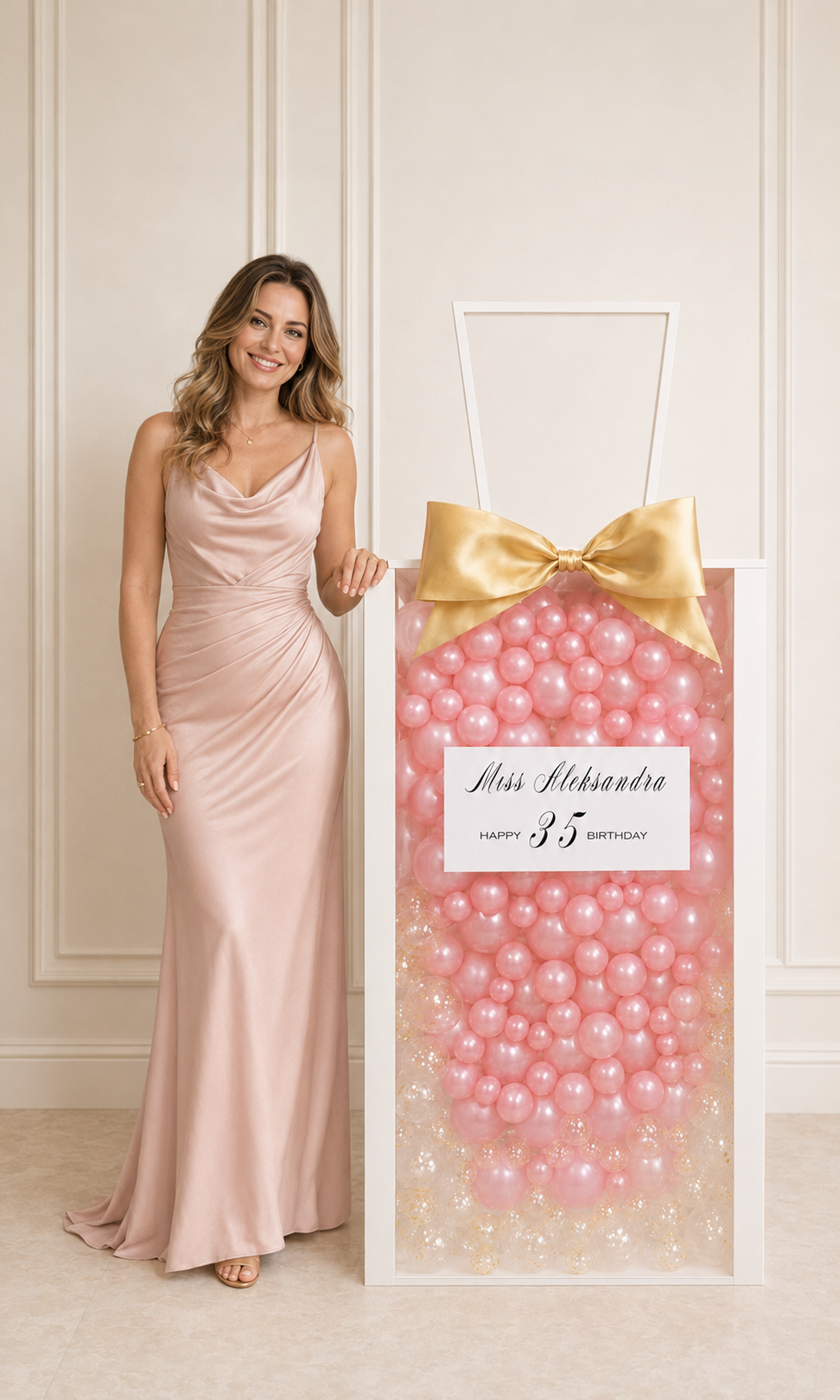 Woman beside a luxury personalized pink balloon gift box for a 35th birthday in Toronto