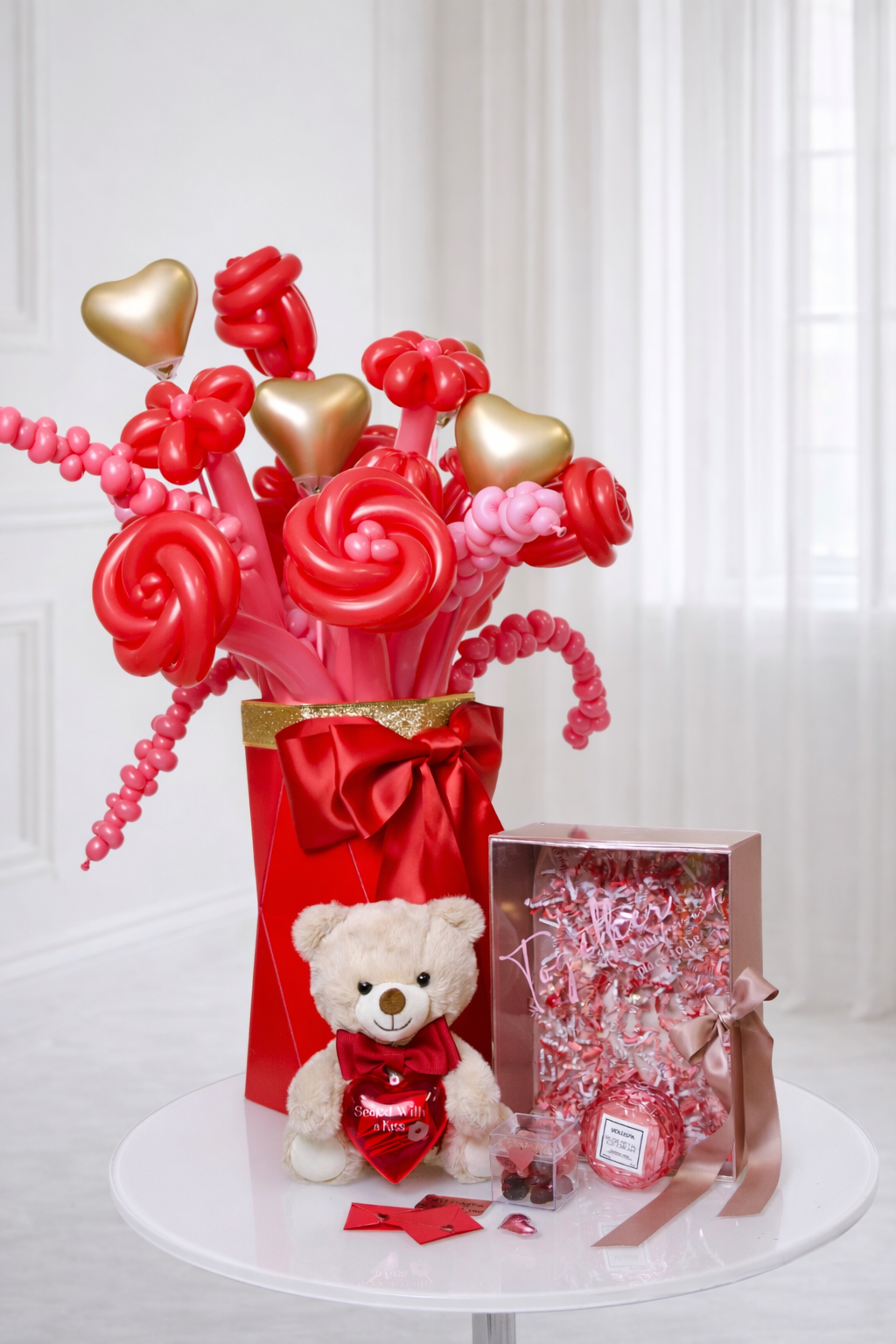 Luxury red balloon flower bouquet with teddy bear and romantic gift box for Valentine’s Day gift delivery in Toronto.