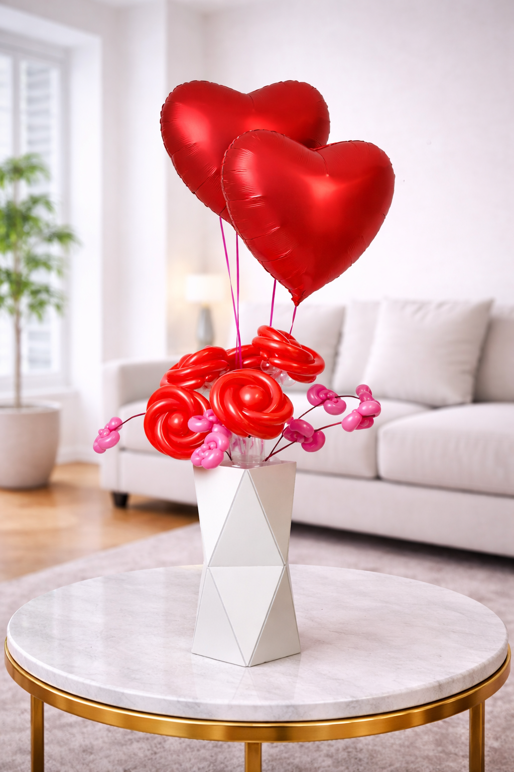 Romantic red heart helium balloons with balloon flower arrangement in decorative vase for Valentine’s Day decoration in Toronto.