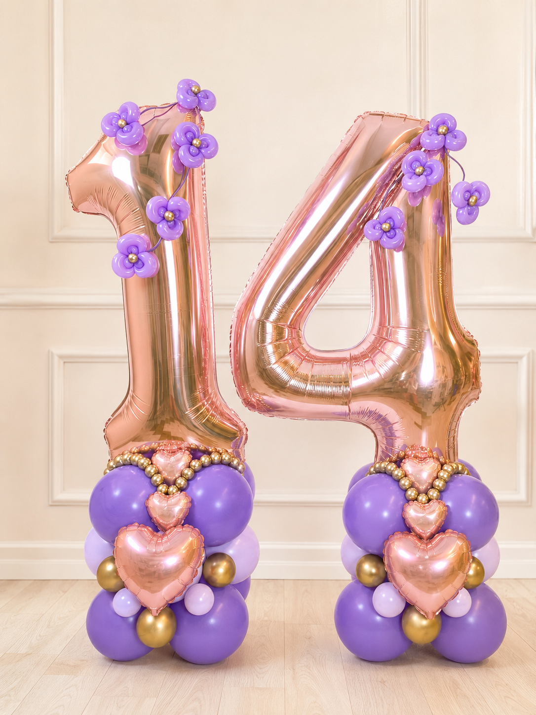 Luxury rose gold double-digit number balloon stands with lavender flowers and hearts in Toronto