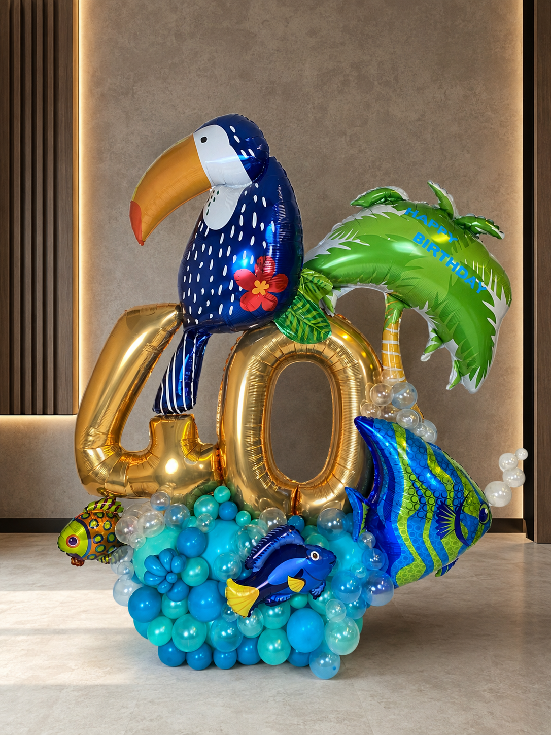 Tropical ocean milestone balloon display with metallic numbers, toucan, palm, and ocean-blue base for men's birthday celebration in Toronto